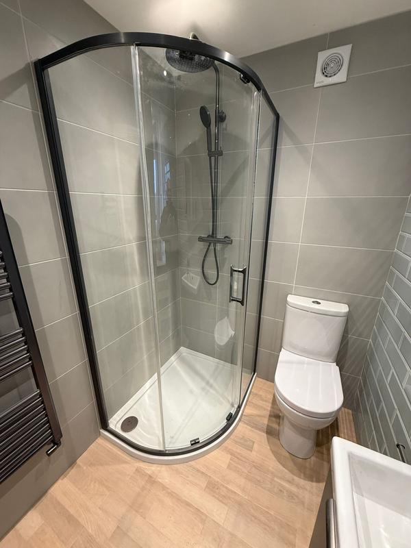 Quadrant shower enclosure with dark trim